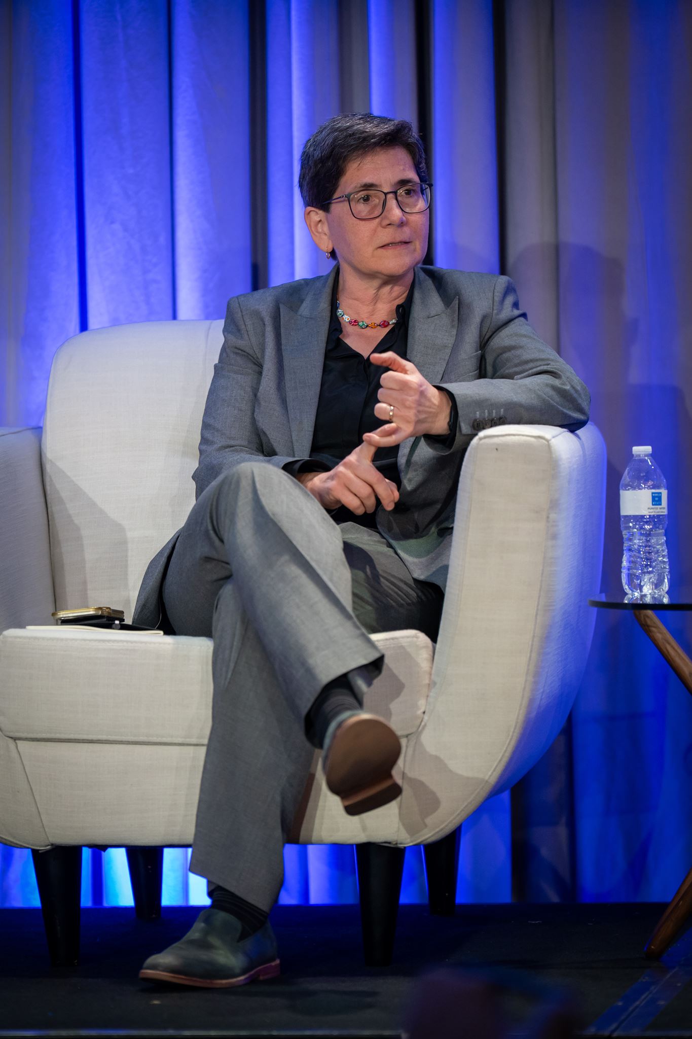 Woman sitting on chair in front of the session.