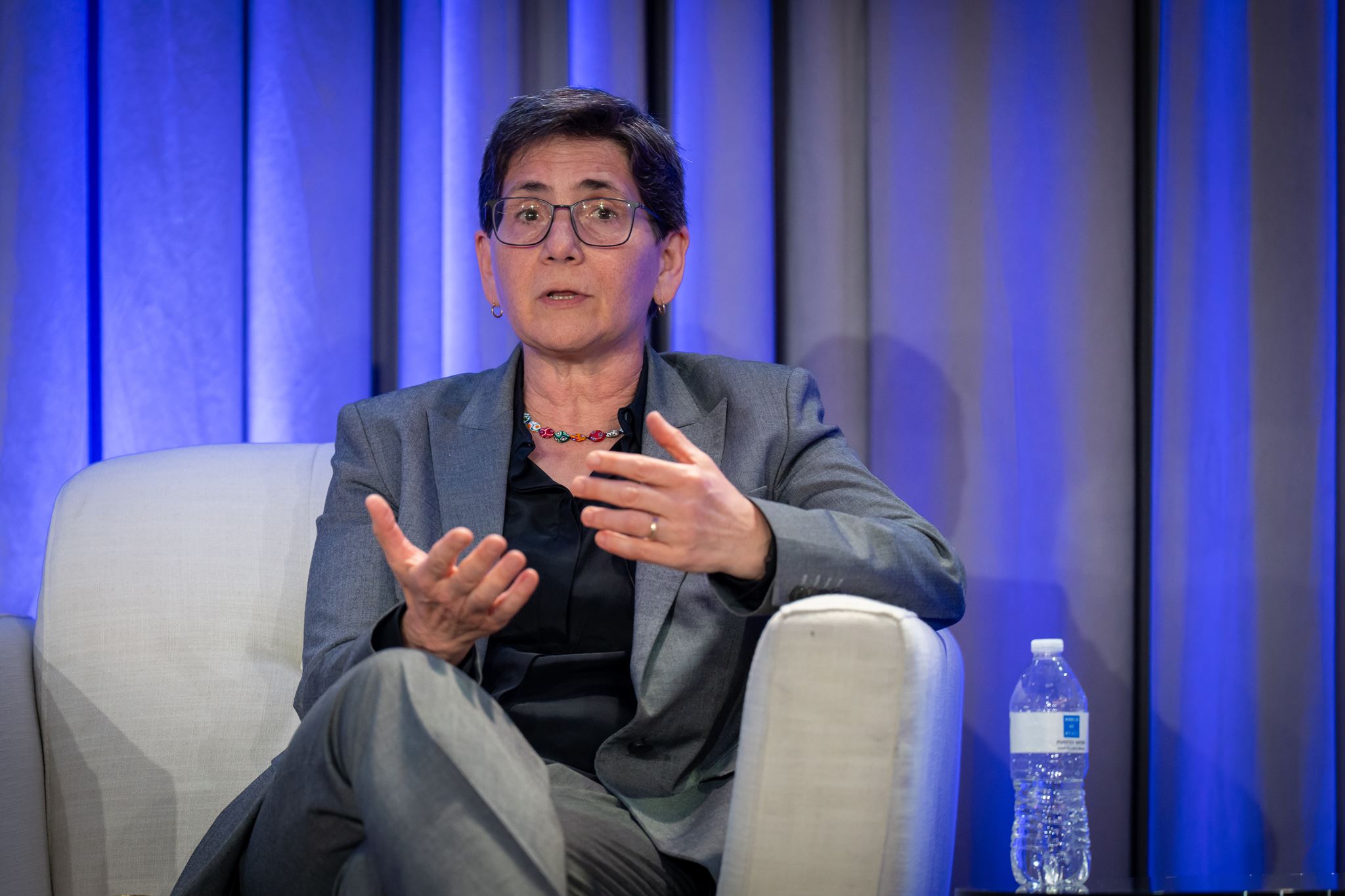 Woman sitting on chair in front of the session.