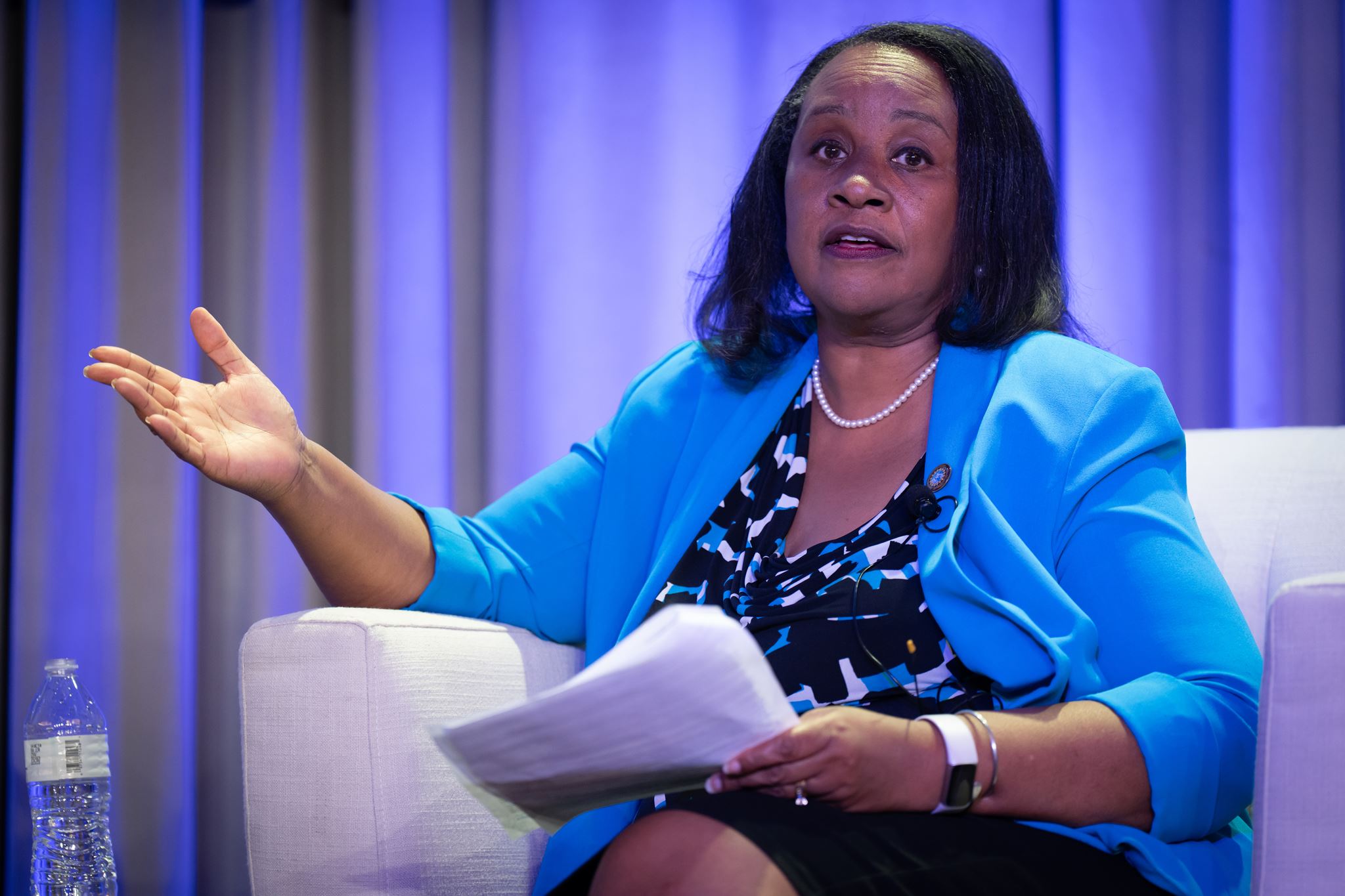 Woman sitting on chair in front of the session.