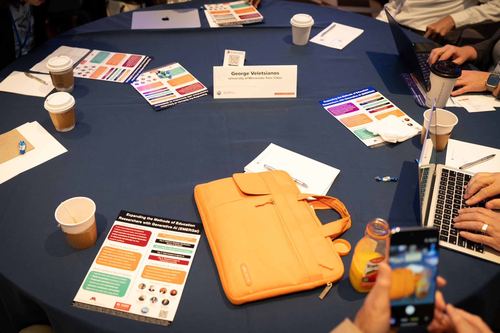 Table with lots of handouts spread out. 
